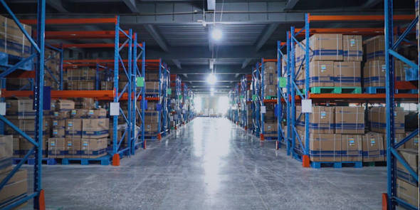 The containers are neatly placed in the warehouse